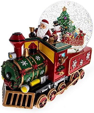 Дедо Мраз, снежен човек и ирваси кои испорачуваат дрво на возот музички воден свет